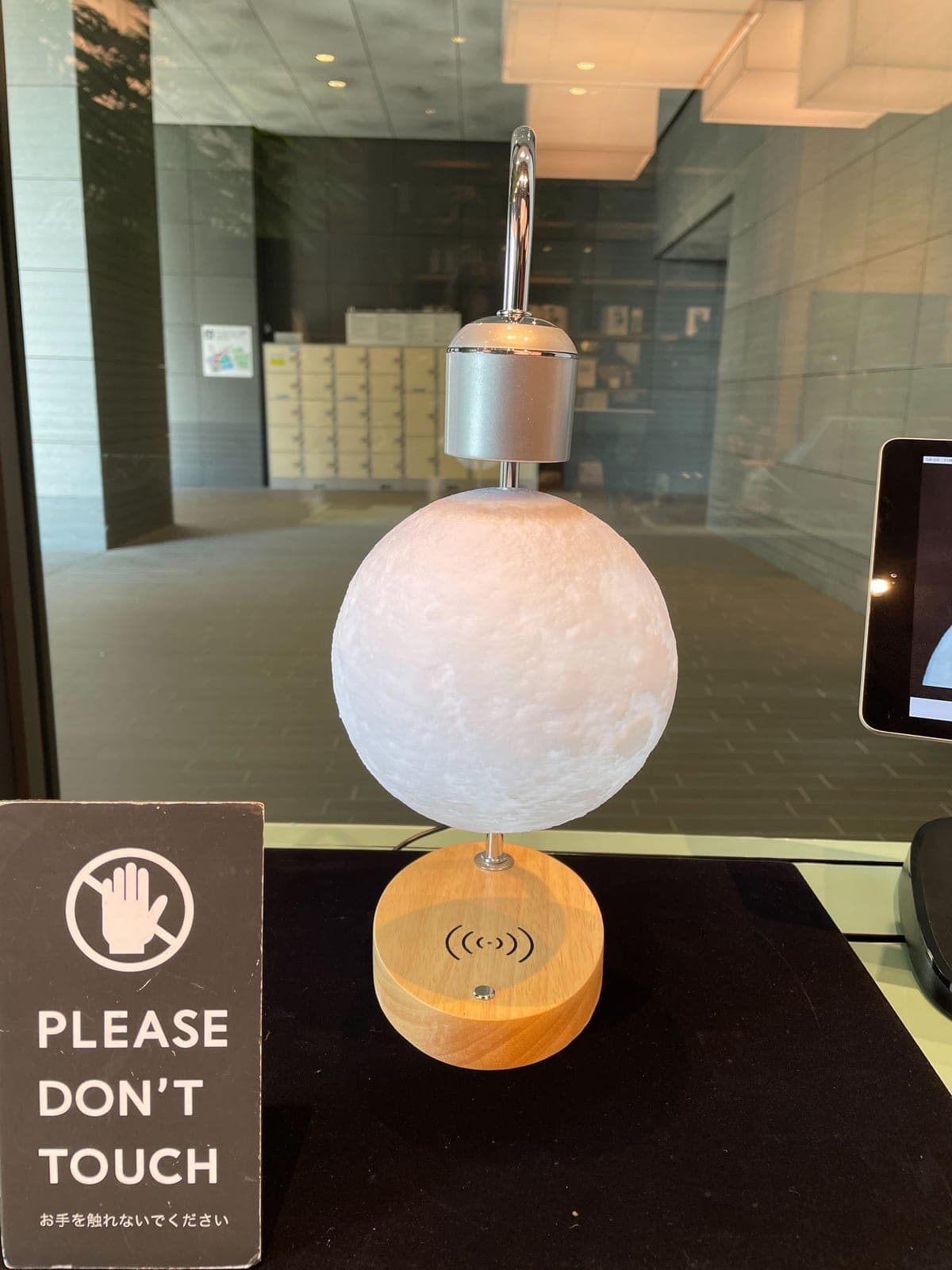 Moon G floating above its base on display